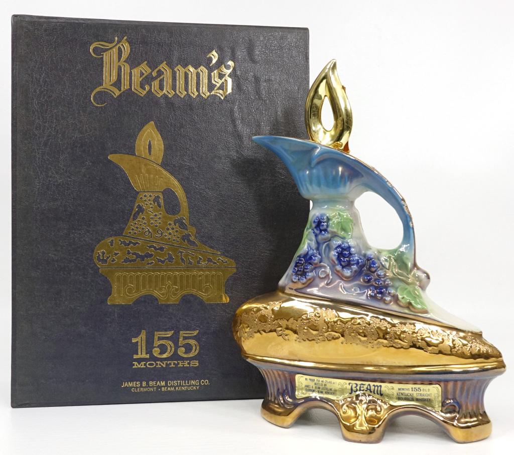 1977 Jim Beam Decanter - Grapes/Gold Base: 155 mo. old, in box. Sealed, 80 proof. 750 ml. IF YOU MAY NEED SHIPPING YOU MUST SPEAK WITH IAN BEFORE BIDDING ON BOTTLES.