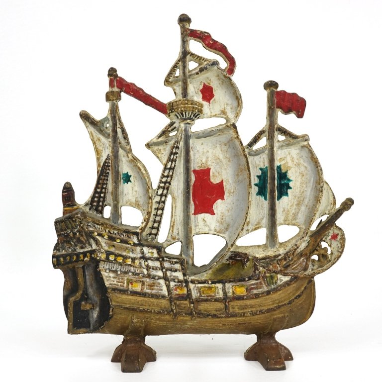 Cast Iron Ship: 11" tall ,10.5" wide. Base 3". (Note - the 2nd ship which was part of this lot was violently sunk and removed from the auction).