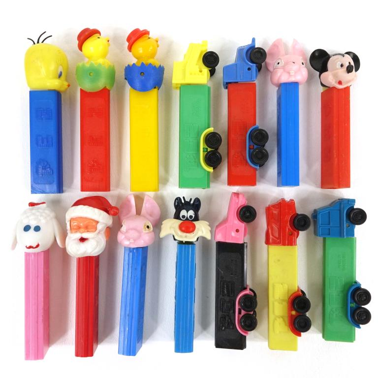 14 Vintage Pez Dispensers: 14 vintage Pez dispensers.