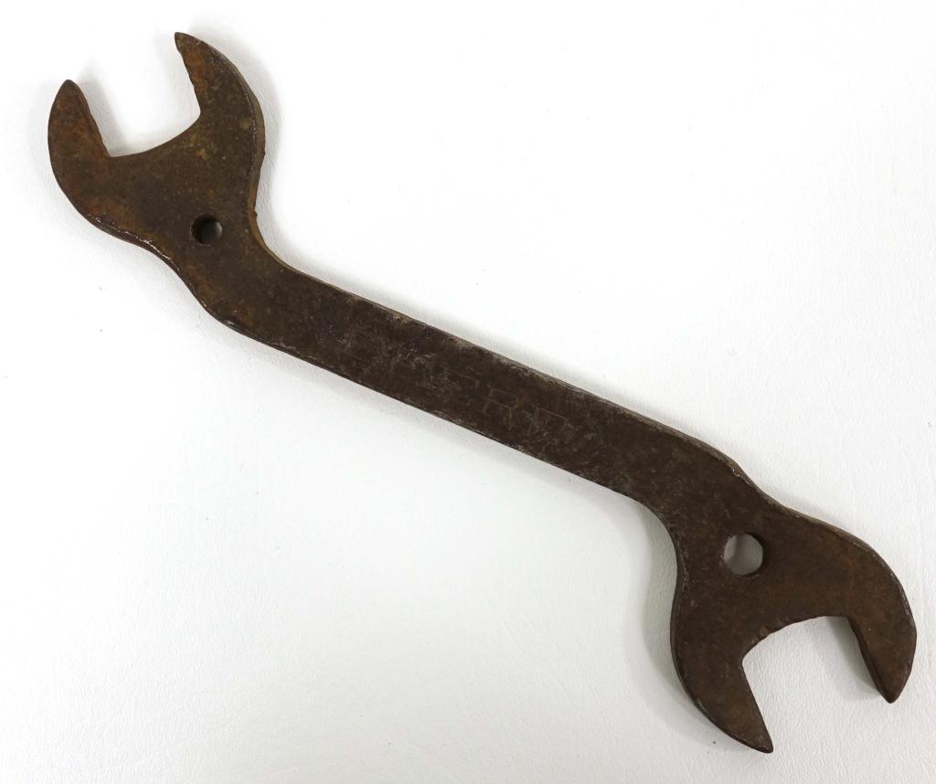 John Deere Vintage Wrench & Fargo Cap: 11 1/2" wrench marked DEERE. Fargo Foundry Pipe Cap, 10" x 5 1/2".