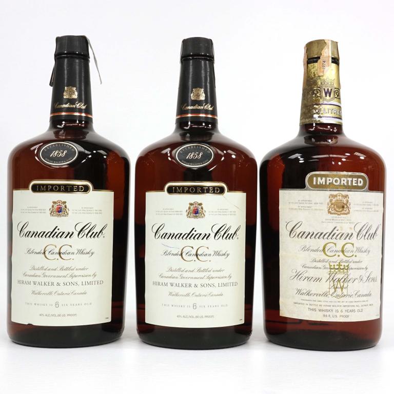 Three Canadian Club Blended Whisky Bottles: IF YOU MAY NEED SHIPPING YOU MUST SPEAK WITH IAN BEFORE BIDDING ON BOTTLES. 1 L.; 3 x 750 ml, 1980, 1984, and ? Box. 80 proof.
