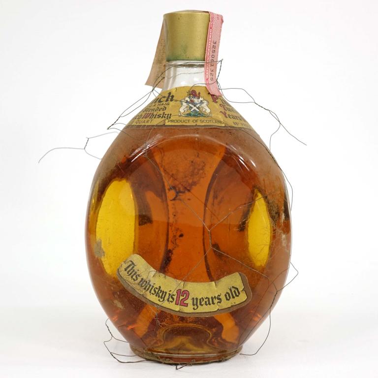 Bottle: Pinch Old Blended Scotch Whisky: ***IF YOU MAY NEED SHIPPING YOU MUST SPEAK WITH IAN BEFORE BIDDING ON BOTTLES! 847-625-0555!*** Pinch Old Blended Scotch Whisky: 86 proof, 4/5 qt and seal is present, but detached from bottle.