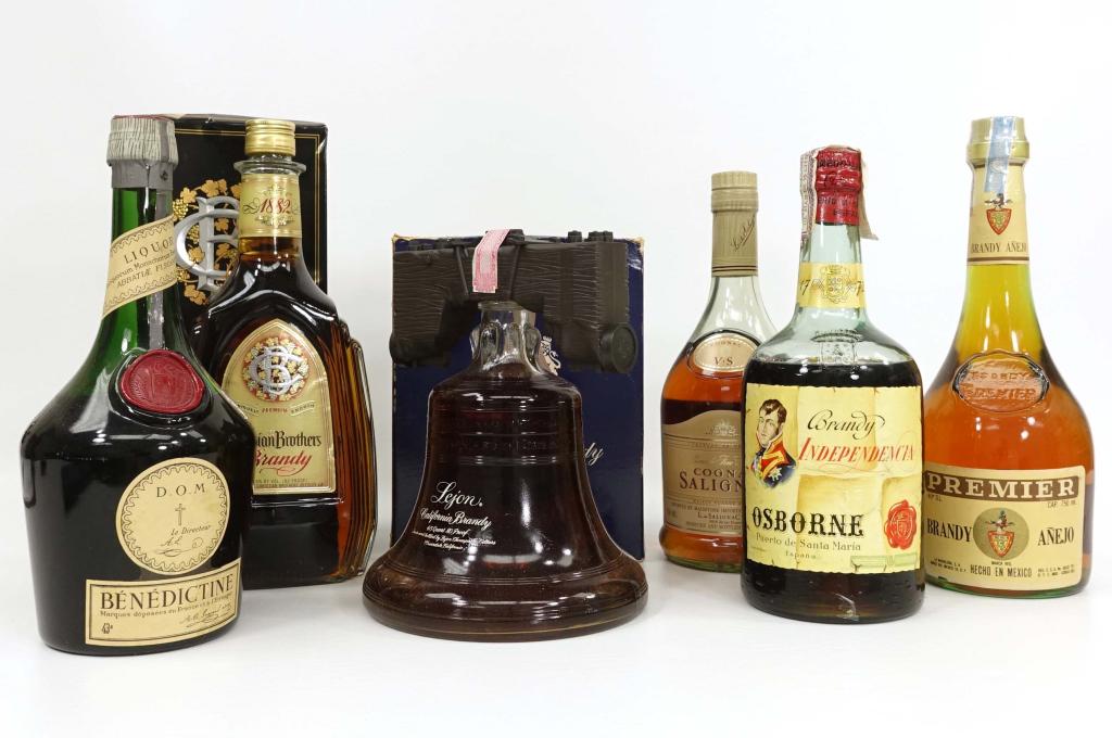 Bottle Assortment: IF YOU MAY NEED SHIPPING YOU MUST SPEAK WITH IAN BEFORE BIDDING ON BOTTLES. Brandy Independencia - Osborne Peurto de Santa Maria, sealed with strip. Dom Le Directeur Benedictine, sealed. Cognac Salign