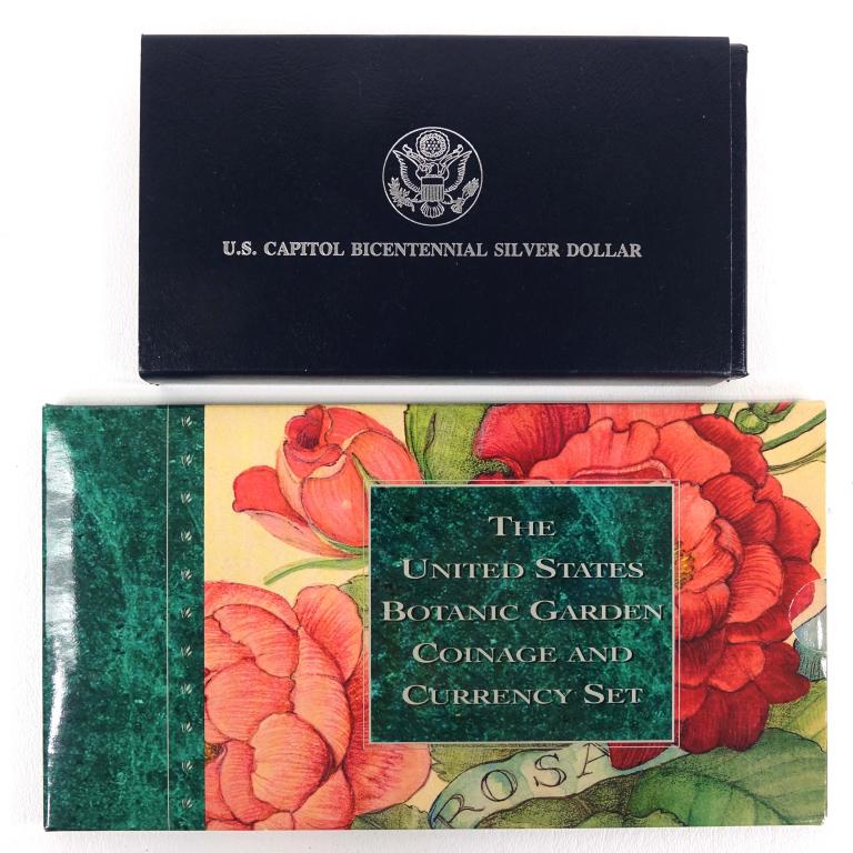 Capitol & Botanic Garden Silver Dollars: 1994-s Capitol Bicentennial commemorative silver dollar in original U.S. Mint packaging. Also, 1997-p uncirculated Botanic Garden silver dollar with 1997 nickel and 1997 dollar bill set.
