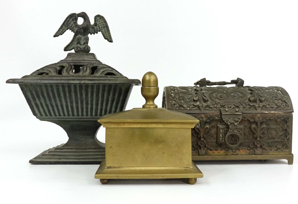 Metal Vintage Box Lot (3): Eagle CASH 26-14 Iron Stove Top Humidifier (7 1/2" x 5 1/2" x 9"). Decorative (non-opening) bronze and iron chest (7 1/2 x 4 1/2" x 5"). Heavy brass lidded box (5" x 3" x 5 1/4").
