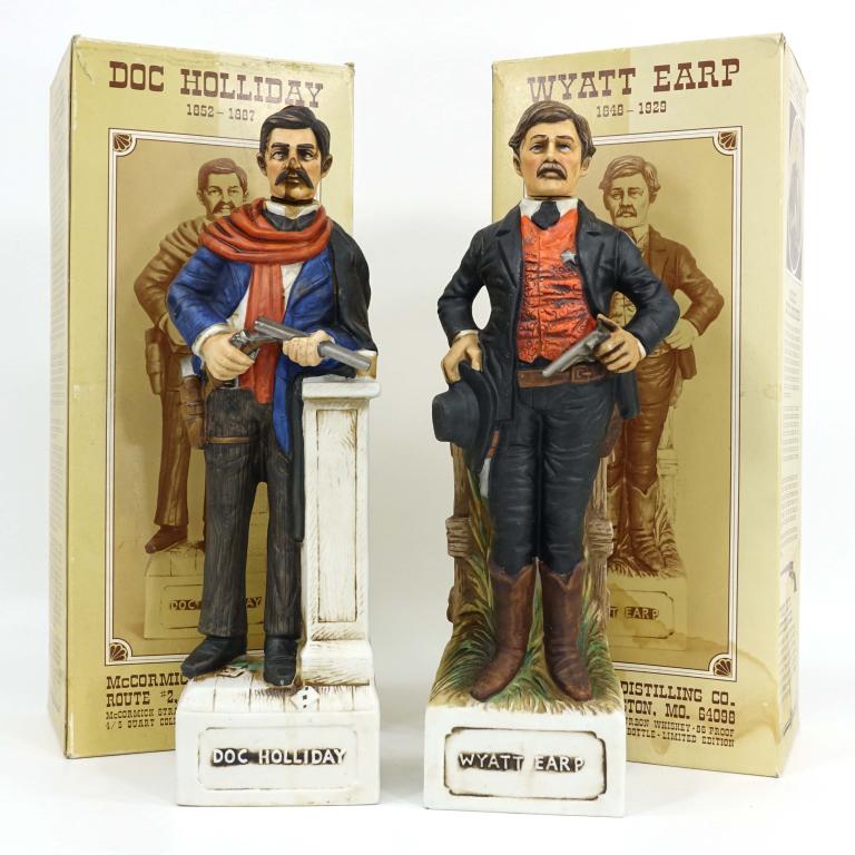 2 Doc Holiday Straight Bourbon Whiskey Bottles: IF YOU MAY NEED SHIPPING YOU MUST SPEAK WITH IAN BEFORE BIDDING ON BOTTLES. One empty bottle. Both with boxes. Doc Holiday and Wyatt Earp. 86 proof.
