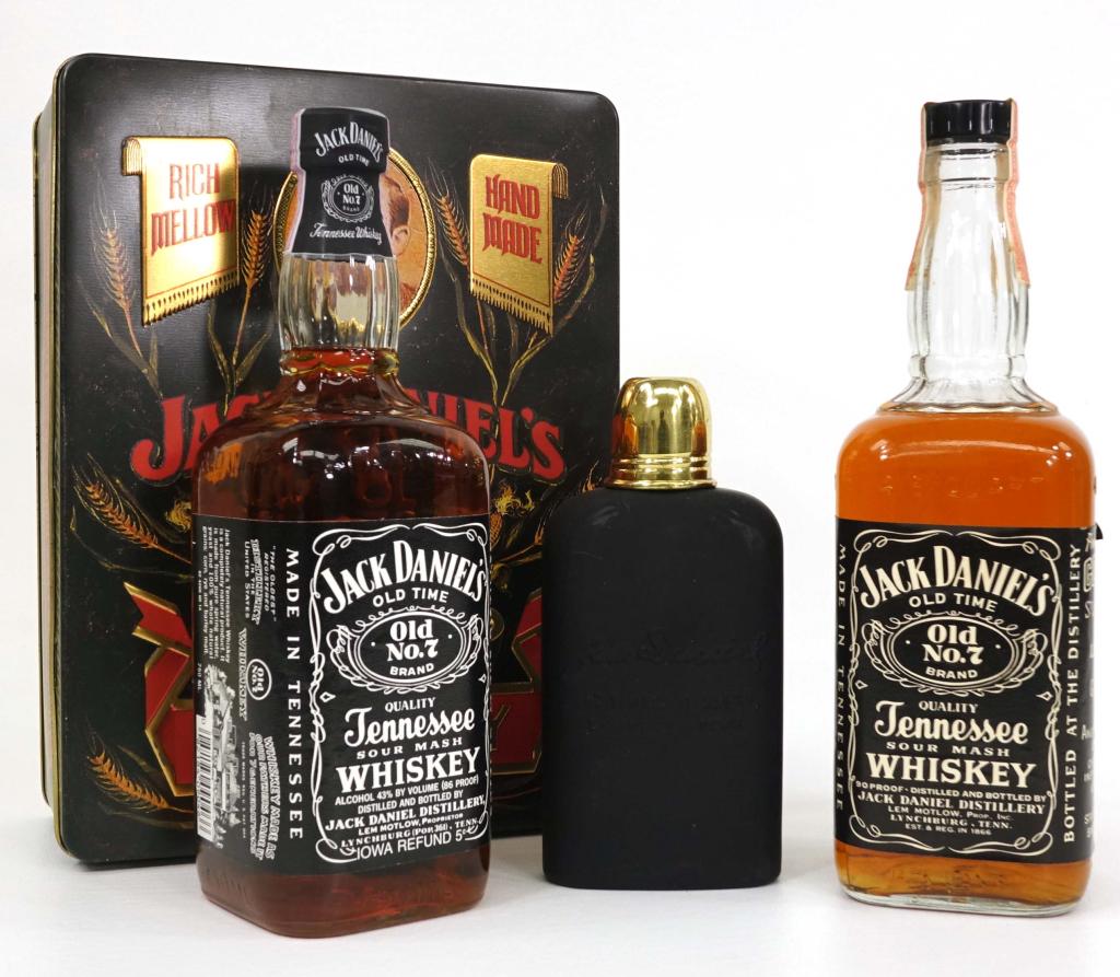 1989 & 1975 Jack Daniels Whiskey Bottles: IF YOU MAY NEED SHIPPING YOU MUST SPEAK WITH IAN BEFORE BIDDING ON BOTTLES. 1989 Jack Daniels Whiskey, sealed with tin display case, gift with JD flask, 86 proof. 1975 Jack Daniels Whiskey, 4/5 sealed