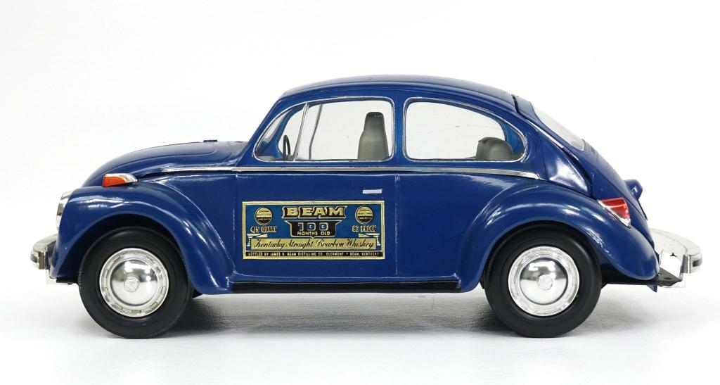 1973 Jim Beam VW Beetle Decanter, Sealed: IF YOU MAY NEED SHIPPING YOU MUST SPEAK WITH IAN BEFORE BIDDING ON BOTTLES. Full 100 month old Beam Whiskey Decanter. Appears good condition, with scratch over right rear wheel fender and slight scuff