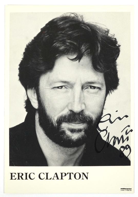 Eric Clapton Autographed Photograph: Eric Clapton autographed 4 x 5 13/16" black & white photograph. ** Lot 14 makes the following guarantee: If either Professional Sports Authenticator (PSA) or Beckett Global, or James Spence Authentica