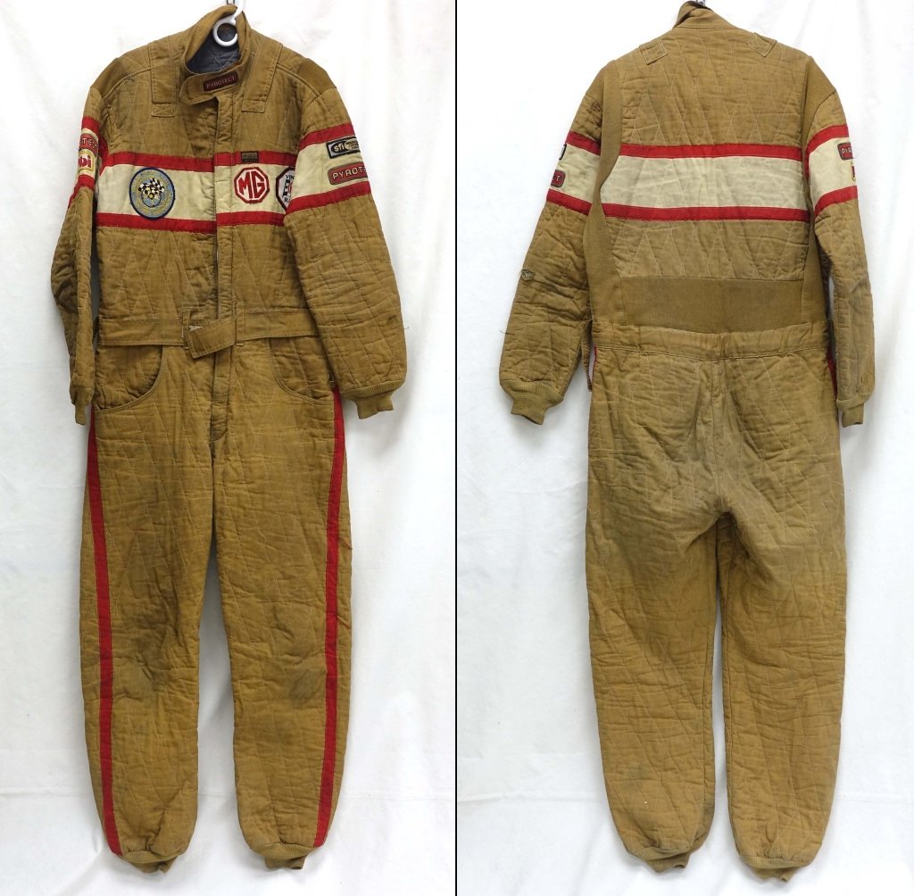 Vintage MG British Race Car Driver's Fire Suit: Pyrotect Professional. Size L with some wear: one hole and small tear at the right knee. Patches: Pyrotect & PBI (right shoulder); Vintage Sports Car Drivers Association (left breast); MG [octagonal],