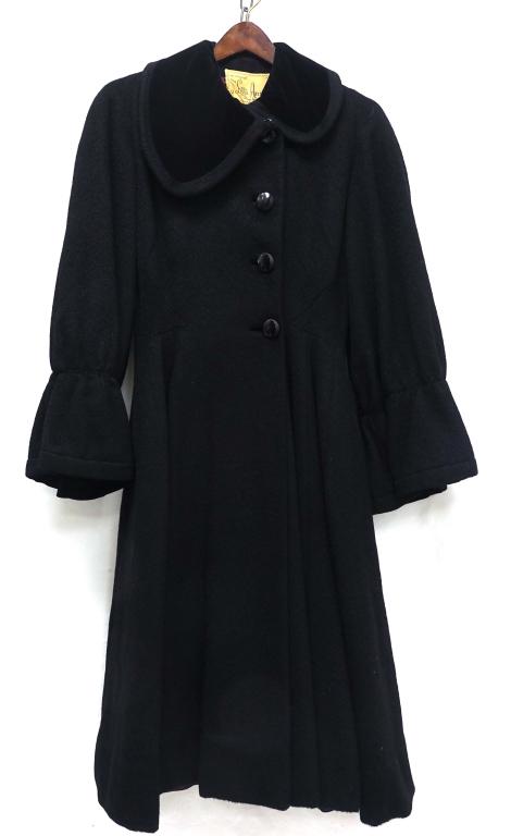 Lilli Ann Tea Length Coat: Black wool with velvet collar and cuffs. Approx. size 4. There are two tears in the lining.