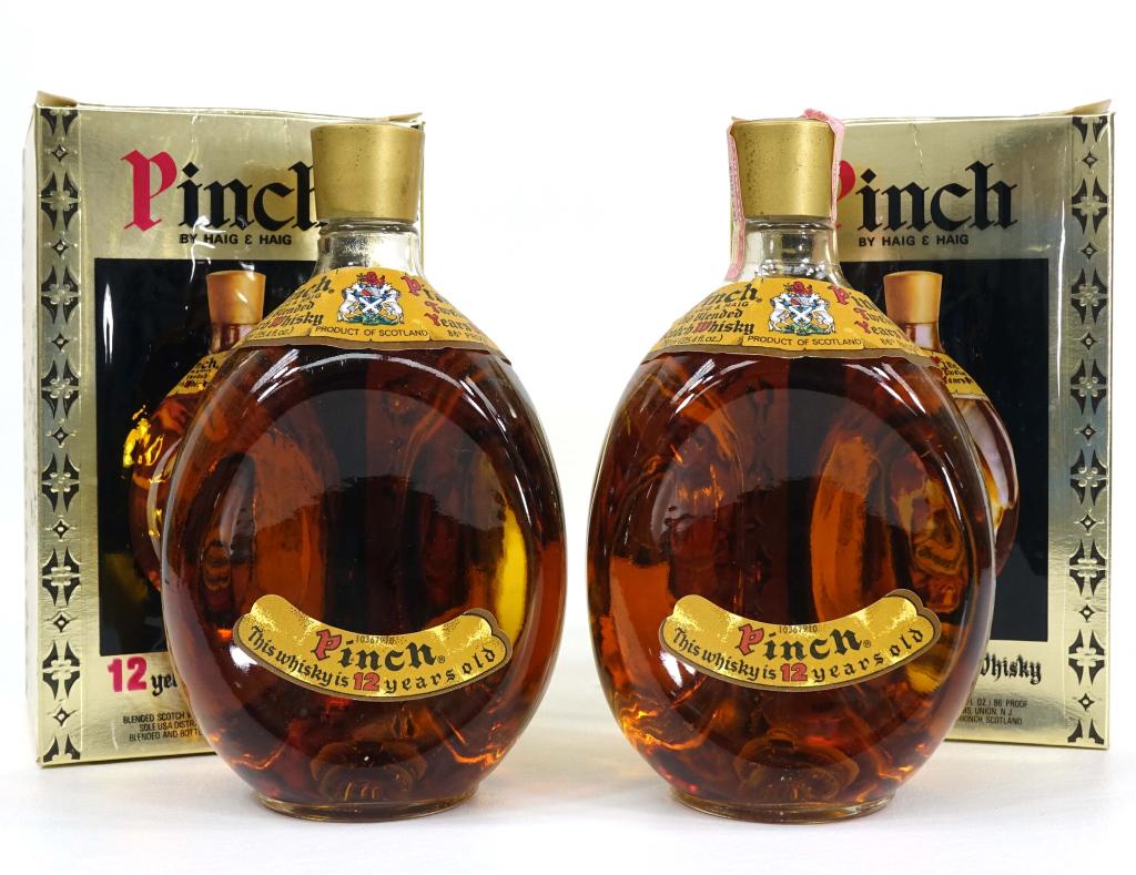 Haig & Haig Pinch Whiskey Bottles (2): IF YOU MAY NEED SHIPPING YOU MUST SPEAK WITH IAN BEFORE BIDDING ON BOTTLES. 12-year, sealed in box. 750 ml, 86 proof.