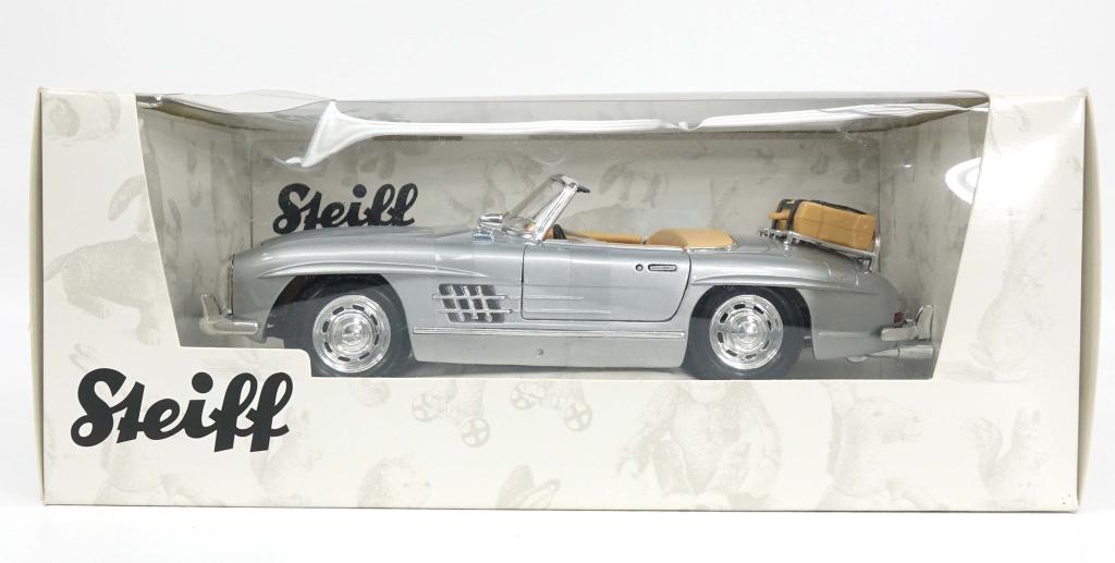 Steiff 1957 Mercedes-Benz 300 SL Touring: Steiff 1957 Mercedes-Benz 300 SL Touring. This is a limited edition teddy bear that comes with a vehicle. There is moderate damage to the box.