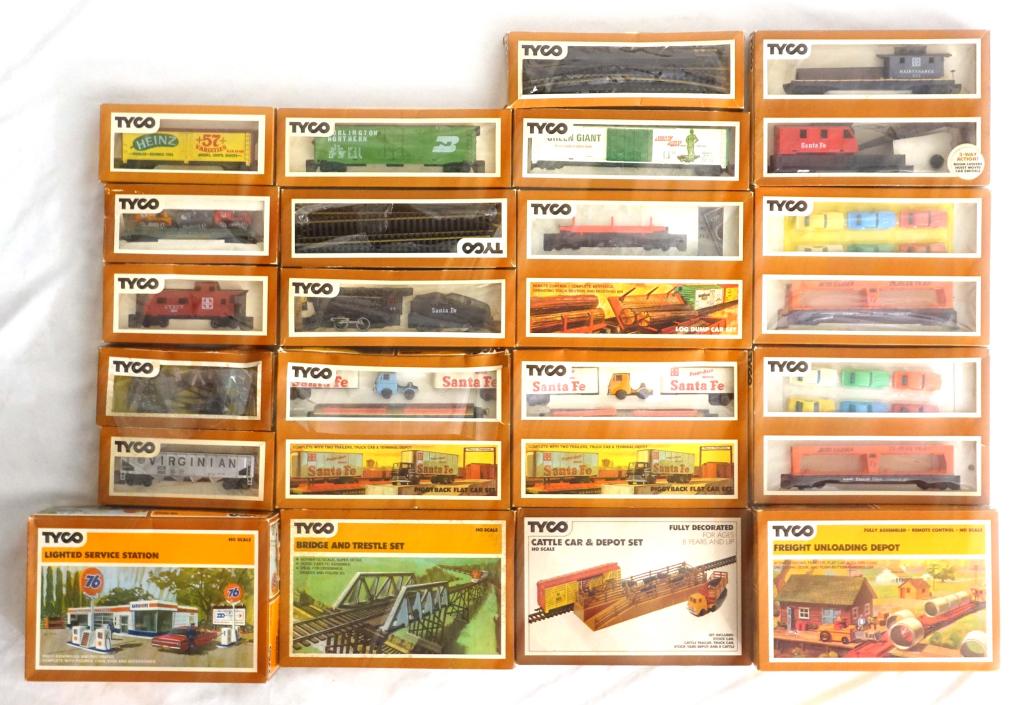 Assortment Of Tyco Accessories (HO Scale): Assortment Of Tyco Accessories (HO Scale). Includes the Cattle Car & Depot Set, Bridge And Trestle Set, Log Dump Car Set, Lighted Service Station, as well as numerous train cars and track accessories!
