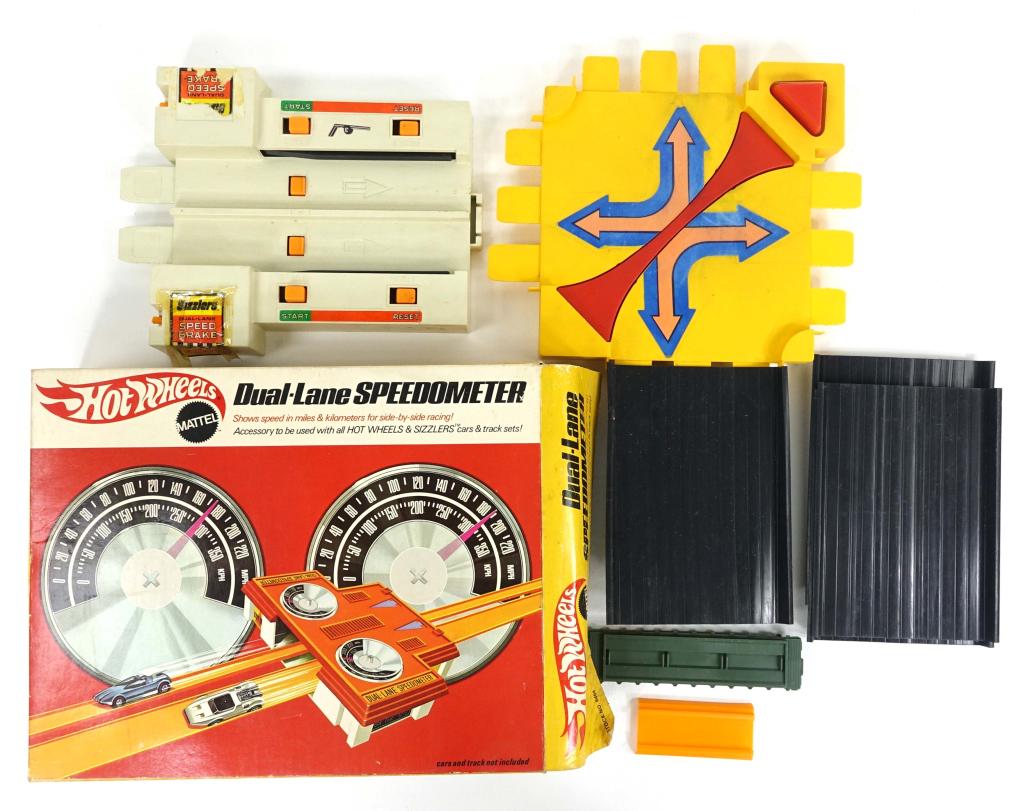 Vintage 1969 Hot Wheels Dual-Lane Speedometer: Vintage 1969 Hot Wheels Dual-Lane Speedometer. Also includes some track accessories. Still in original box with moderate damage.