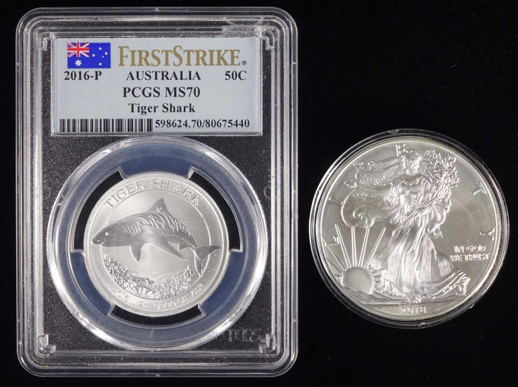 2016-p Australia Tiger Shark & 2018 Silver Eagle: 2016-p Australia Tiger Shark half dollar, graded by PCGS as MS70 First Strike. 1/2 troy ounce of 0.9999 fine silver. Also includes a 2018 United States Silver Eagle $1 bullion coin (1 troy ounce of 0.