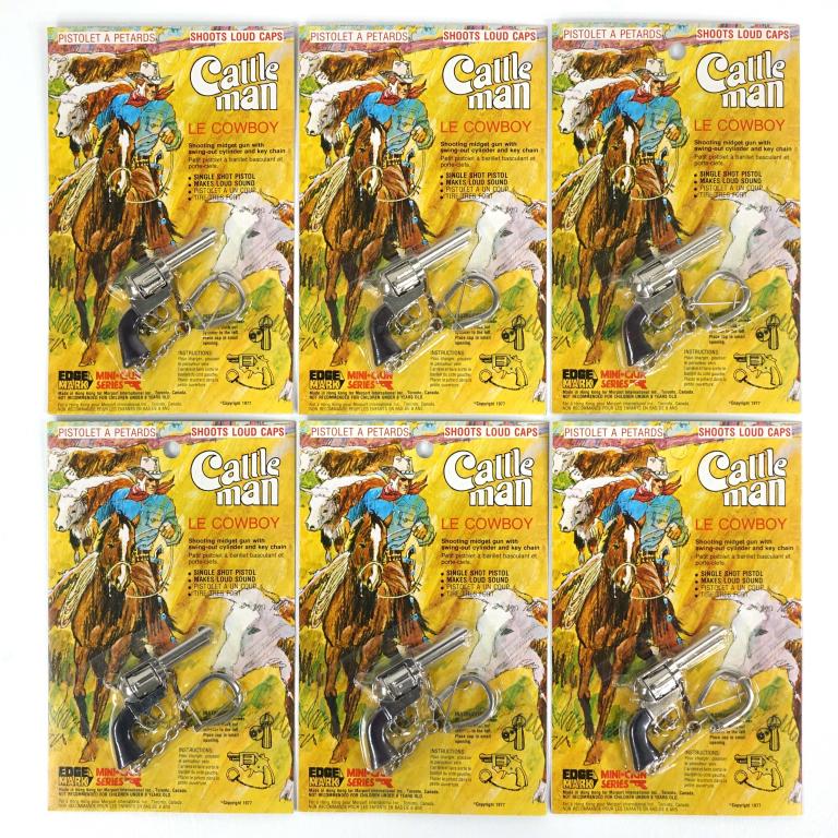Cattle Man Le Cowboy Loud Cap Guns (6): Vintage Cattle Man Le Cowboy Loud Cap Guns (6). Manufactured in 1977. Still unopened never been used.