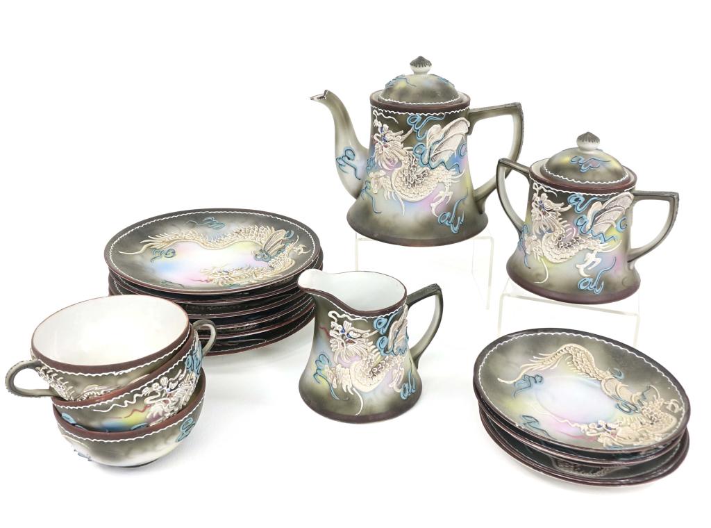Japanese Dragonware: 3 small vases, 2-3" tall. Teapot with lid - 6" tall, small chip on spout. Sugar bowl with lid and creamer. 6 plates (1 with small chip), 5 saucers (2 with 2 chips each), 3 cups (1 with small chip). Wi
