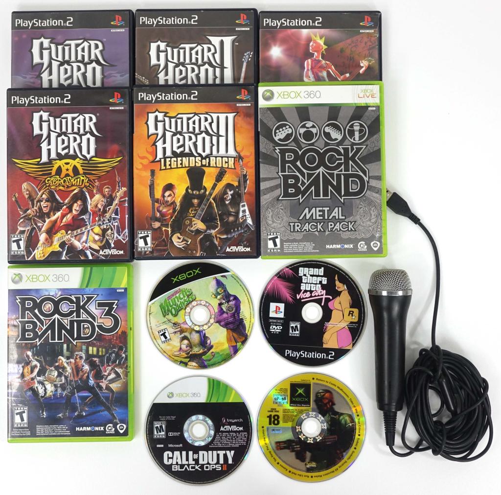 (10) PS2 & Xbox 360 Games (With Accessories!): (10) PS2 & Xbox 360 Games (With Accessories!). Includes (6) PS2 games they are Guitar Hero, Guitar Hero II, Guitar Hero III, Guitar Hero Aerosmith, Guitar Hero Encore & Grand Theft Auto Vice City. Als