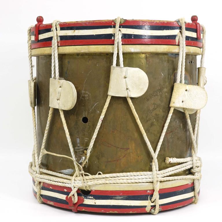 British Canadian Infantry Brass Drum: WWII era, brass shell with white rope, red, white and blue hoops, marked Whaley Royce Co. Toronto. Some dents and oxidation to shell, has wood insert to make it a coffee table. 15" x 15", 10 lbs.