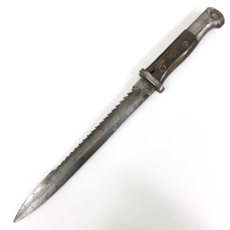 German WWI Mauser Saw-Back Bayonet: Blade marked Erfurt with a crown and GEBR. HELLER MARIENTHAL, with black painted scabbard, looks to be repainted.