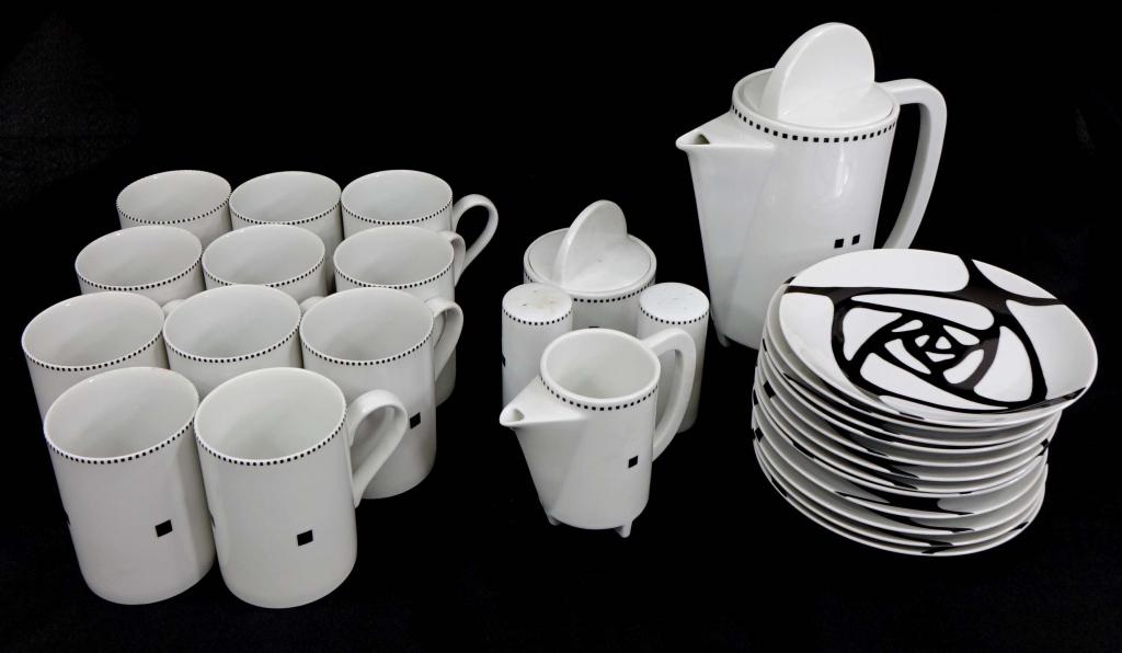 Swid Powell Tea Set & Plates: "Tuxedo" set; 1 teapot 9" tall, 1 creamer, 1 sugar pot, pair salt & pepper shakers, 11 classy mugs 3" diameter. "Roses" plates. 12 total, 6.5" diameter.