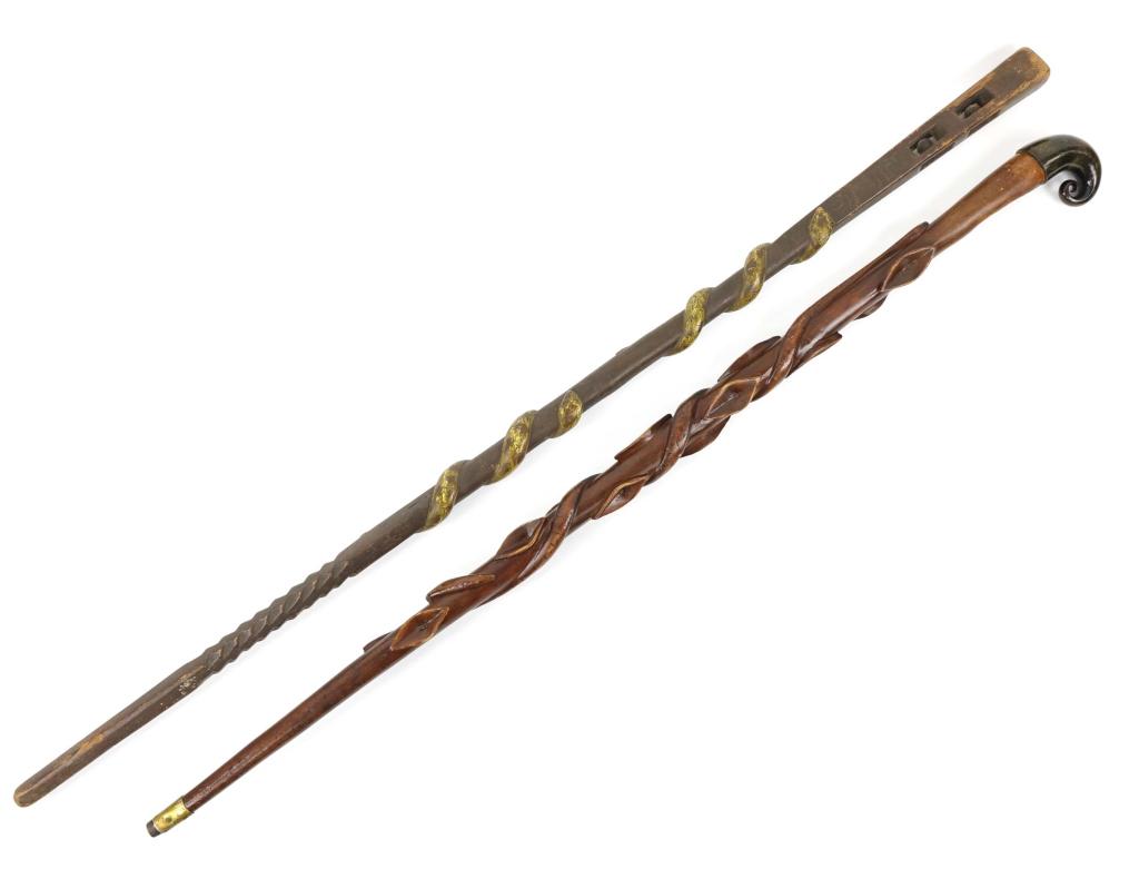 Folk Art Snake Carved Canes/ Walking Sticks (2): One carved with a snake and the initials JLJ. The other carved with a snake with a horn handle. Longest is 40" inches.