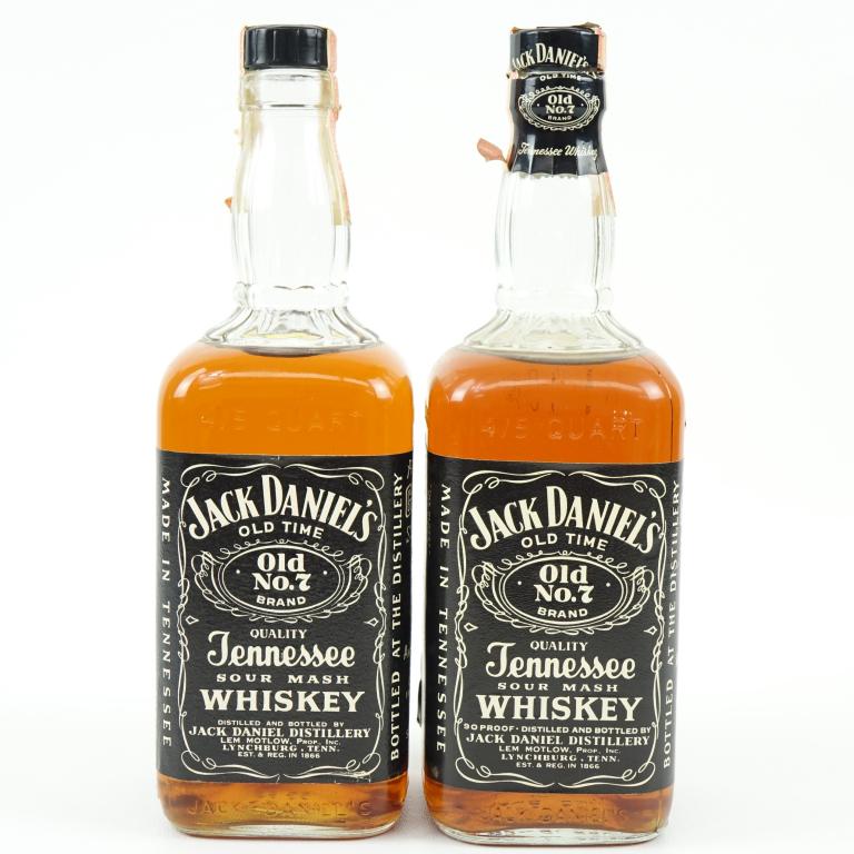 1969 & 1975 Jack Daniels Whiskey Bottles (2): *** IF YOU'RE NEW TO US AND MAY NEED SHIPPING PLEASE GIVE US A CALL BEFORE BIDDING ON BOTTLES! 847-625-0555 *** 1969 & 1975 Jack Daniels Sour Mash Whiskey Bottles (2): 4/5 qt and both have ***BROKEN S