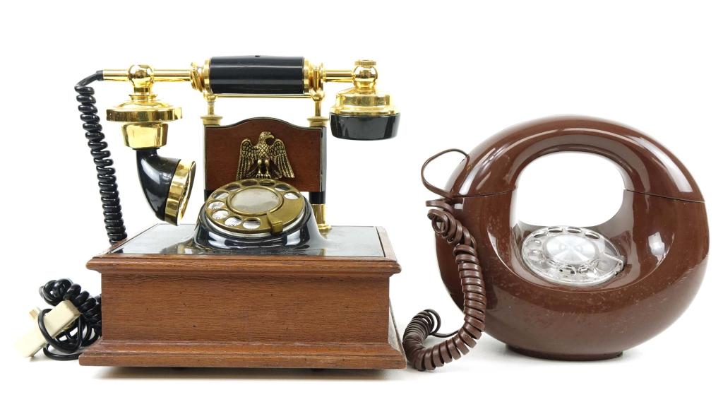Two Dial Telephones: Western Electric brown phone and one wood black + brown colored phone- some scuffs, crack in back of phone hand piece handle- General Telephone Systems.