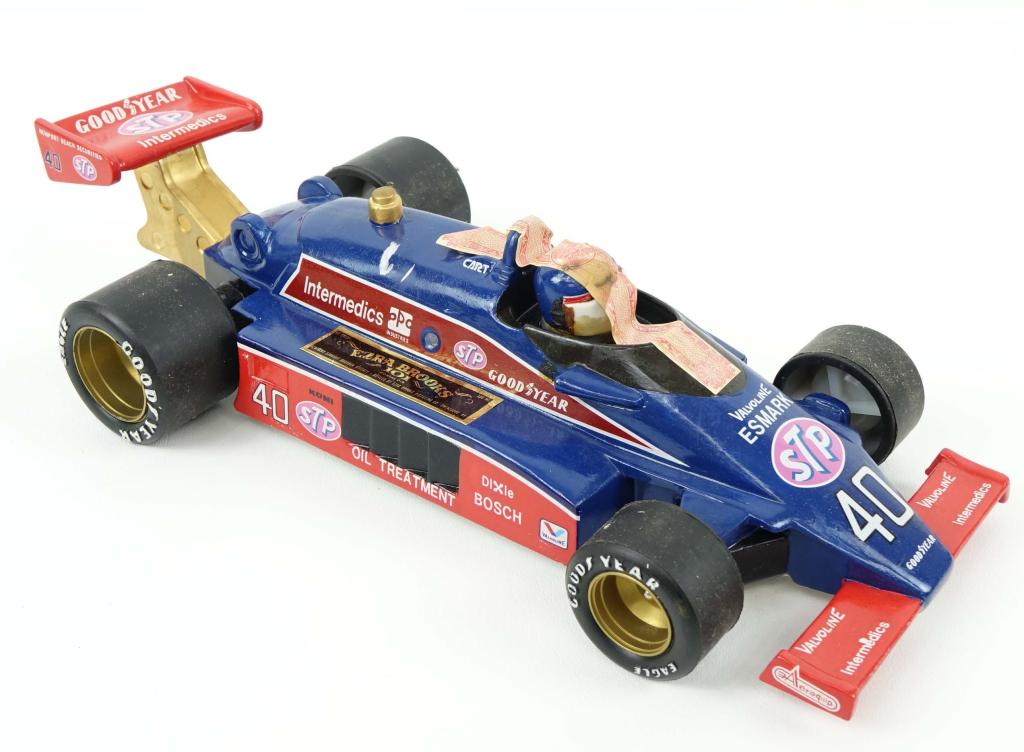 1983 Ezra Brooks Indy Car Decanter: IF YOU MAY NEED SHIPPPING YOU MUST SPEAK WITH IAN BEFORE BIDDING ON BOTTLES. Goodyear STP Indy Car. In box. 80 proof. 500 ml.