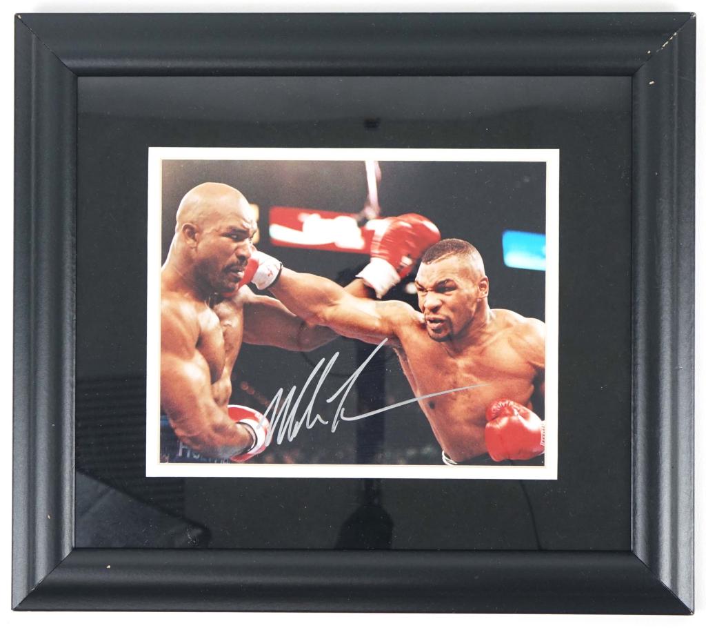 Signed Mike Tyson vs. Evander Holyfield Photo: Signed by Mike Tyson. No authentication. 17x15. Black frame.