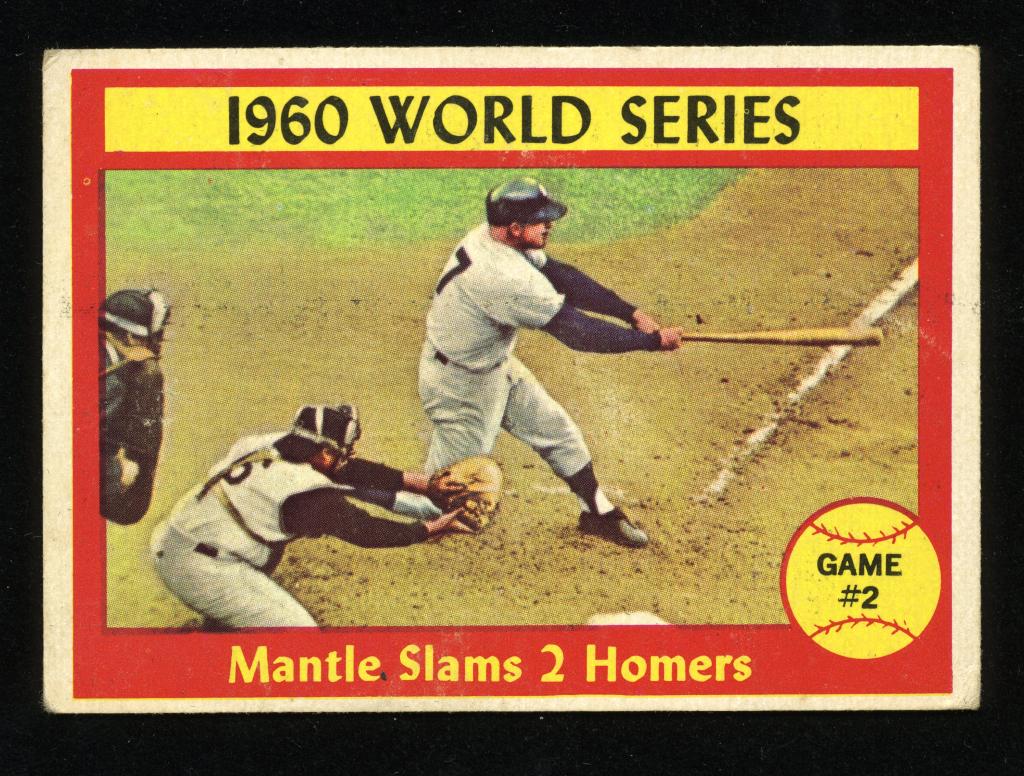 WS Game 2 - Mantle - 1961 Topps Baseball Card #307: 1961 Topps baseball card #307 - World Series Game 2: Mantle Slams 2 Homers. Decent, though imperfect centering, but three of the four corners have seen better days. The New York Yankees behind Mantle 