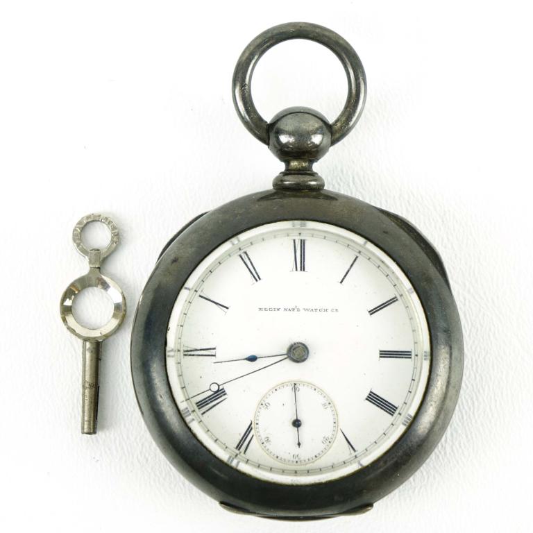 Elgin Nat'l Watch Co. Pocket Coin Watch & Key: Size: 18s; Jewels: 13-15; Grade: 81. c. 1880. Movement Configuration: Hunter Case; Comes with winding key. Case is marked "Newport Coin". Movement #733704. Watch winds, but watch is not running. Key i