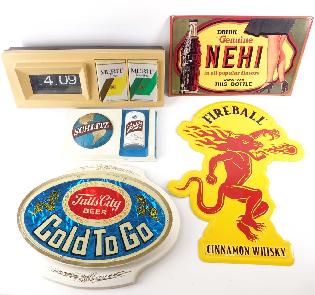 Vintage Ad Signs: Merit Cigarette wall clock (works) (19 1/4 x 7 3/4 x 4"). Schlitz wall sign (12 x 7 1/2 x 3/4"). Falls City wall sign. Nehi sign. Fireball Whiskey sign.