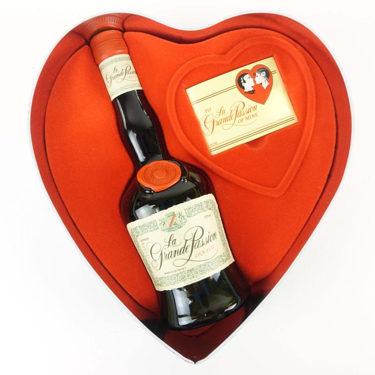 La Grande Passion Liqueur: *** IF YOU MAY NEED SHIPPING YOU MUST SPEAK WITH IAN BEFORE BIDDING ON BOTTLES 847-625-0555 ** La Grande Passion Liqueur: 48 proof, 375ml and sealed in tin heart box.