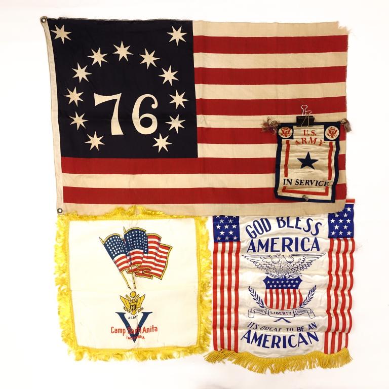 U.S. & Bicentennial Flag / Silk Banners Lot: Vintage Bicentennial Flag; has some fraying along the edges, but overall in good condition. WWII US Army In Service door banner: 10 1/4" long, 7 3/4" wide. Has about a 2" tear. Vintage Camp Santa Anit