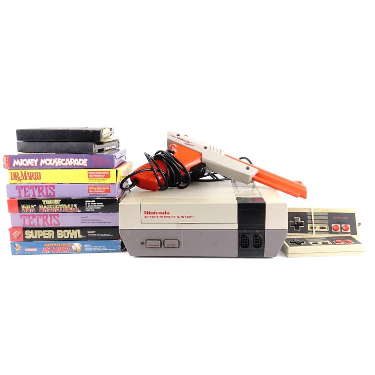 NES Game Console (With 9 Games + Accessories): NES Game Console (With 9 Games + Accessories). Many of the games have their original cases with manuals. Also comes with a gun for shooting games like Duck Hunt. We were unable to test the NES to see