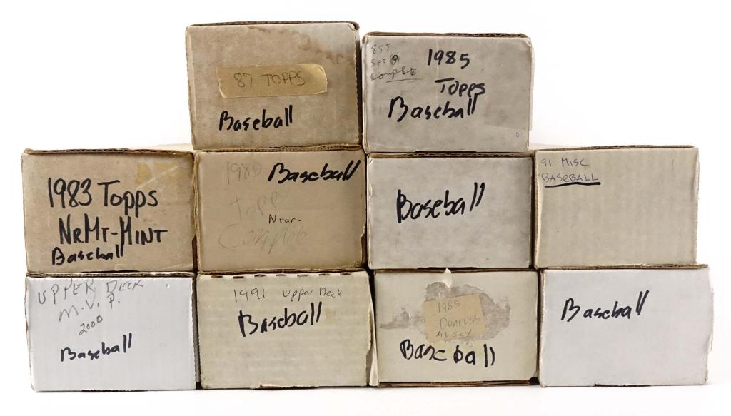 Large Baseball Card Lot: -1983 Topps -1980 Topps (near complete set) -1987 Topps -1985 Topps -2000 Upper Deck MVP -1991 Upper Deck -1985 Donruss (partial set) -Also includes 3 boxes of misc. baseball cards. **We are unsure if