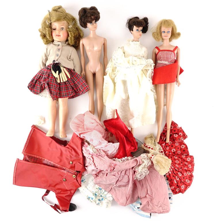 Vintage Barbie Dolls (4) 1960s - 80s??: Vintage Barbie Dolls (4). We were unable to confirm how old they are but they seem to be from the 60s-80s. They also come with a small assortment of outfits and clothes. There also seems to be no dama