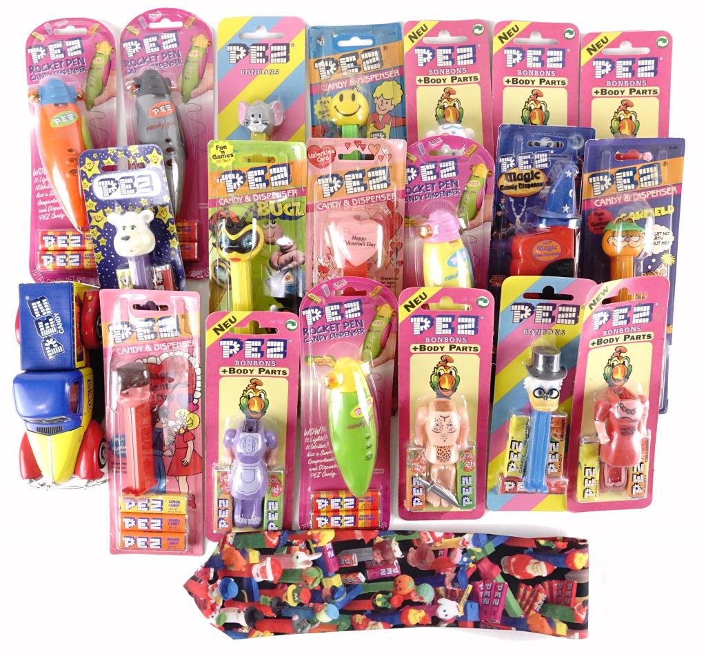 Pez Dispensers Lot: 19 dispensers in package. Also includes Diecast Pez Ford Trunk. Ralph Murlin Pez neck tie (new with tag).