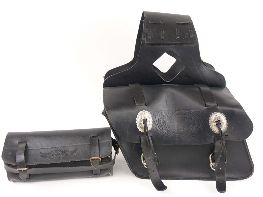 Harley Davidson Motorcycle Bags: 1 pair of leather saddle bags. Bag on each side is approx. 13.5" x 10". 1 handle bar style bag (?). 10.5" x 4.5". Could use a cleaning, but otherwise appears to be in good condition.