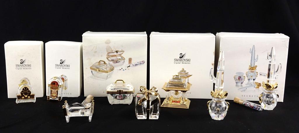 Swarovski Crystal Statues: 5 boxed sets including: Jukebox, cathedral radio (?), Japanese temple, jewelry box set, ring holder / cactus. 3 unboxed pieces including: cradle with missing bedpost, cactus with a broken arm 9 (?) an