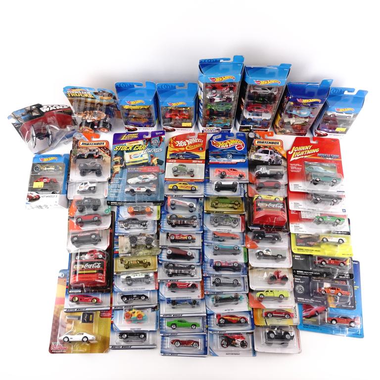Toy Car Lot- Matchbox / Hot Wheels / Etc: About 58 cars in total. Hot Wheels single and box sets. Also includes from Johnny Lightning and one Star Wars Hot Wheel "The Fighter."