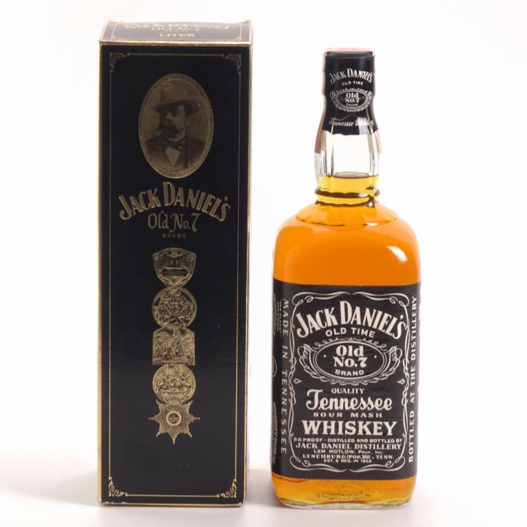 1984 Jack Daniel's 1 Liter Whiskey: ** IF YOU MAY NEED SHIPPING PLEASE CALL US BEFORE BIDDING ON BOTTLES. 847-625-0555. ** 90 proof, 1 liter, and sealed. In box.