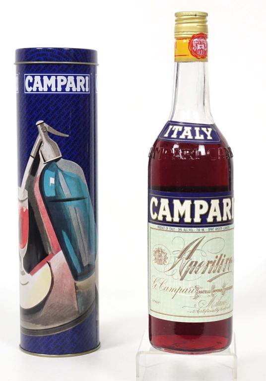 Campari Bottle: ** IF YOU MAY NEED SHIPPING, PLEASE CALL US BEFORE BIDDING ON BOTTLES. 847-625-0555. ** Campari- 24%, 750 ml and full / sealed. With canister. Artificially colored.