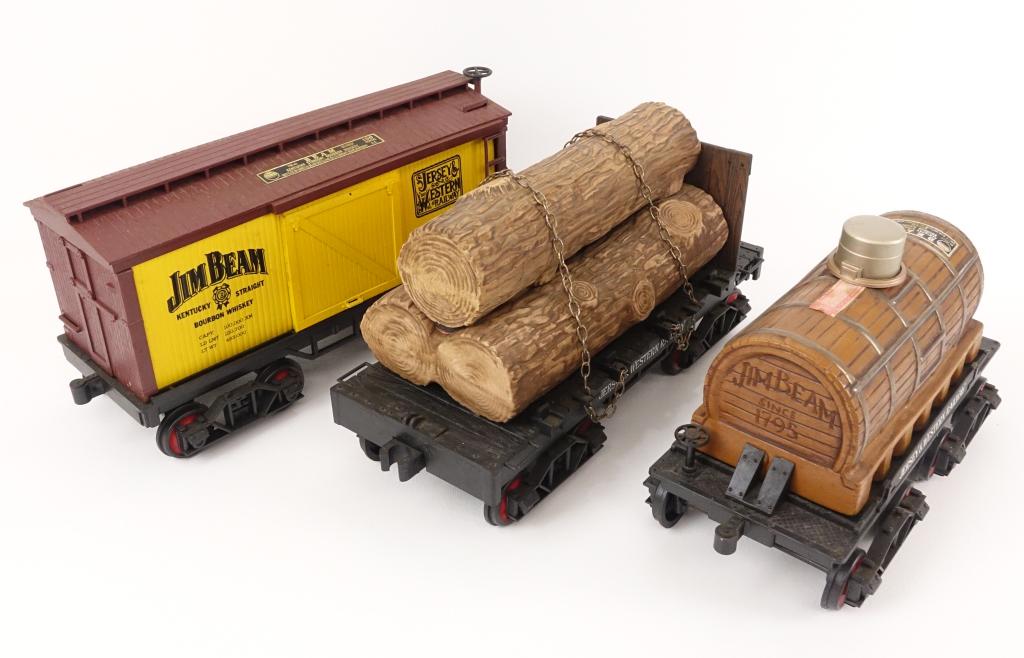 Jim Beam Train Decanters: *** IF YOU MAY NEED SHIPPING ON BOTTLES / DECANTERS, PLEASE CALL US BEFORE BIDDING! 847-625-0555. *** All are 80 proof, and 750ml. Log Car: sealed and feels 3/4 full. Jim Beam Barrel Car: sealed and f