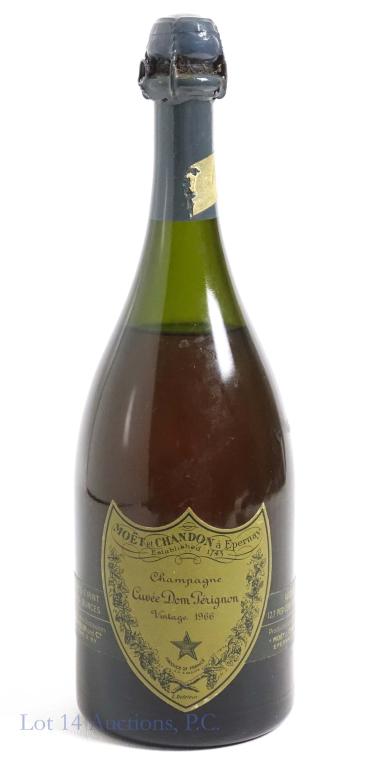 1966 Dom Perignon Champagne: ***IF YOU MAY NEED SHIPPING, PLEASE CALL US BEFORE BIDDING ON BOTTLES. 847-625-0555.*** 12.7%, 1 pt 10oz and sealed. Lot 14 can ship this in time for New Year's, if you call to pay and discuss this so