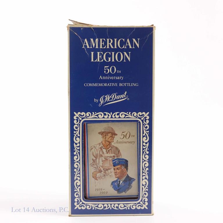 1969 J.W. Dant Bourbon: **IF YOU MAY NEED SHIPPING, PLEASE CALL US AND SPEAK WITH IAN BEFORE BIDDING ON BOTTLES. 847-625-0555.** American Legion 50th decanter. 10-year. In box. Box damaged. Sealed. 86 proof, 4/5 quart.