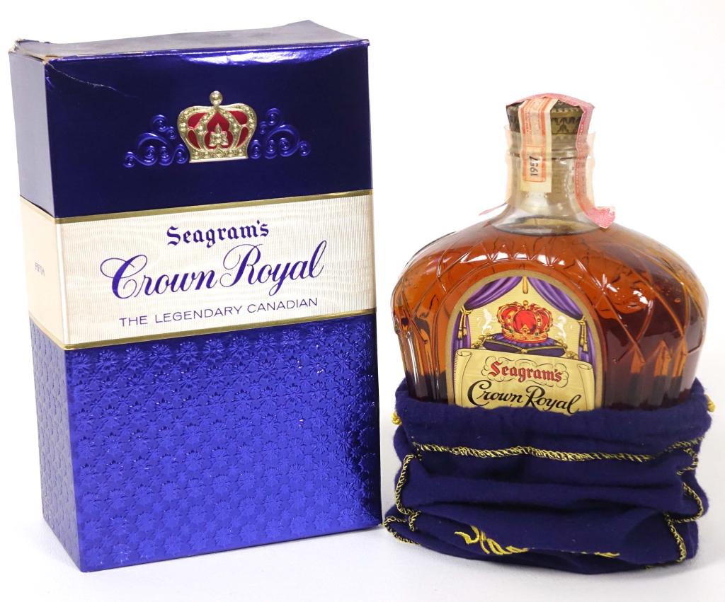 1957 Crown Royal Bottle: ** IF YOU MAY NEED SHIPPING, PLEASE CALL US BEFORE BIDDING ON BOTTLES. 847-625-0555. ** 1957 Crown Royal Bottle: 80 proof, 4/5qt and sealed. In bag. In box.