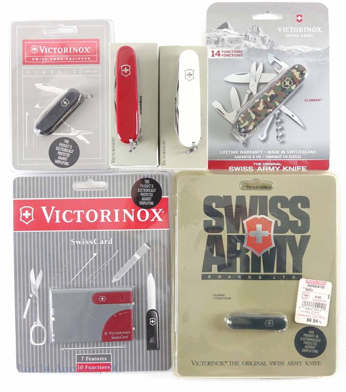 Victorinox Swiss Army Knife New Old Stock Lot: Deluxe Tinker #53481, White Huntsman, Climber (Camo), Classic (x2), and Swiss Card.